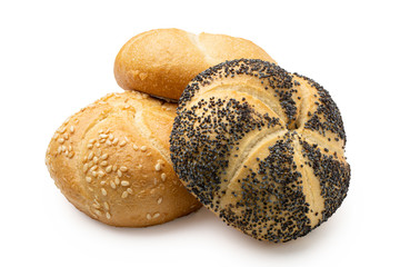 Plain, poppy seed amd sesame seed kaiser rolls isolated on white.