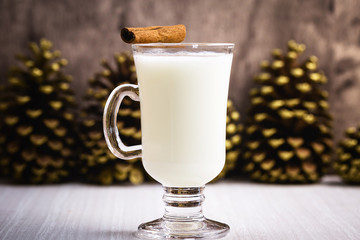 Traditional in the United States and Canada, the drink is made from milk, egg, sugar and nutmeg. It is usually served hot with an alcoholic splash of brandy or rum. Christmas drink.