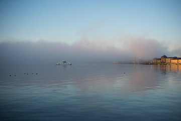 Morning view over Stockholm inner harbour with boats, canoes, piers and islands an autumn day