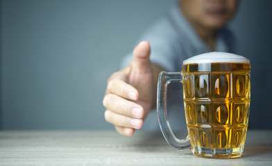 Concept of Withdrawal Symptoms from alcohol or Alcoholic diseases.Hand with a glass of beer on...