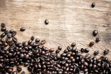 Roasted arabica coffee bean on wood background