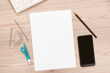 Paper, pencil, ruler, smart phone on wooden desk