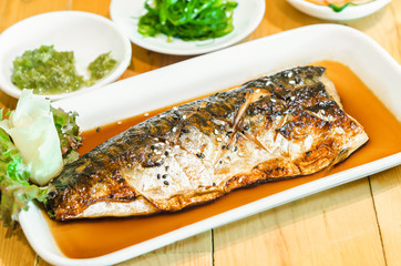 Saba or mackerel fish grilled with soy sauce with black and white sesame.