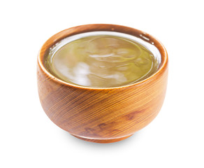 caramel sauce in wooden bowl.