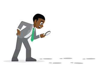  African Businessman holding a magnifying glass follow footprint.