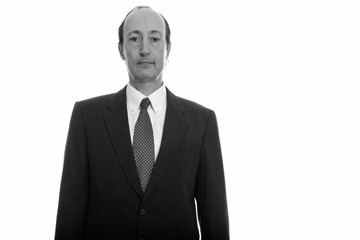 Portrait studio shot of mature man in black and white