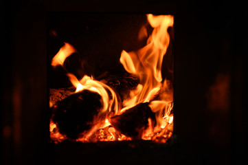 blurred burning coals in the stove