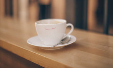 cup of coffee on wooden table