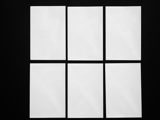 set of blank sheets of paper white on black 
