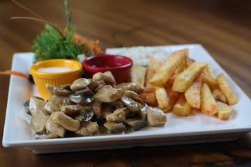 Chicken with Vegetables and French Fries