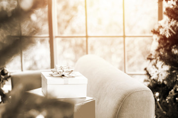 Room decorated with Christmas trees and a gift box with a ribbon Ideas to welcome the upcoming Christmas season