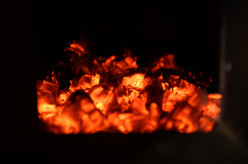 blurred burning coals in the stove