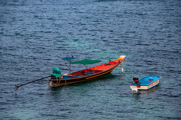 Naklejka na ściany i meble Two fishing boats waiting in the bay.