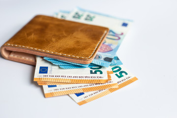 Leather bifold wallet with euro money bill