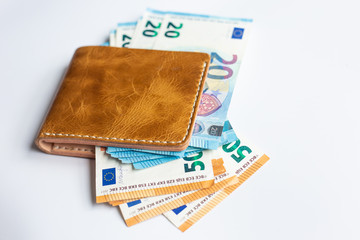 Leather bifold wallet with euro money bill