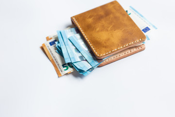 Leather bifold wallet with euro money bill