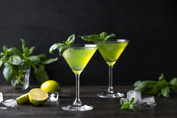 Gimlet cocktail with fresh basil leaves