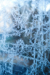 Frosty window, abstract wintry background