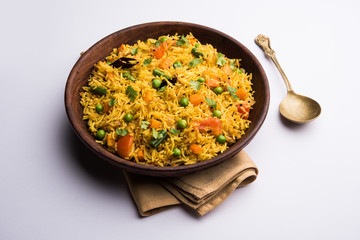 Tawa Pulao/Pulav/Pilaf/Pilau is an Indian Street Food  made using basmati rice, vegetables and spices. Selective focus