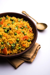 Tawa Pulao/Pulav/Pilaf/Pilau is an Indian Street Food  made using basmati rice, vegetables and spices. Selective focus