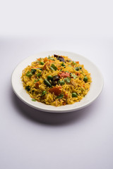 Tawa Pulao/Pulav/Pilaf/Pilau is an Indian Street Food  made using basmati rice, vegetables and spices. Selective focus