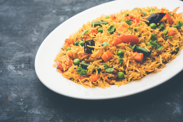 Tawa Pulao/Pulav/Pilaf/Pilau is an Indian Street Food  made using basmati rice, vegetables and spices. Selective focus