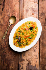 Tawa Pulao/Pulav/Pilaf/Pilau is an Indian Street Food  made using basmati rice, vegetables and spices. Selective focus