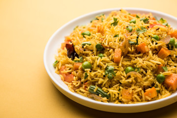 Tawa Pulao/Pulav/Pilaf/Pilau is an Indian Street Food  made using basmati rice, vegetables and spices. Selective focus