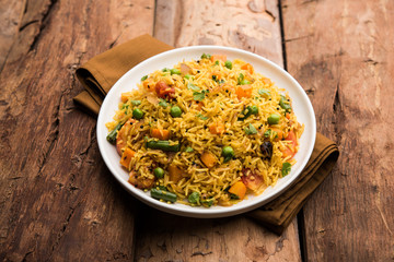 Tawa Pulao/Pulav/Pilaf/Pilau is an Indian Street Food  made using basmati rice, vegetables and spices. Selective focus