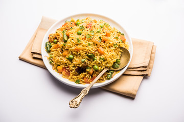 Tawa Pulao/Pulav/Pilaf/Pilau is an Indian Street Food  made using basmati rice, vegetables and spices. Selective focus