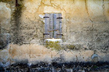 old window in stone wall