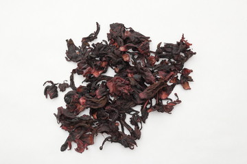 Dried red hibiscus flowers isolated on white background.