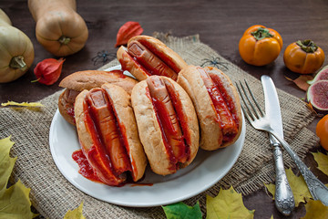 Halloween food. Halloween hot dog. Bloody fingers from sausages in rolls with ketchup. Scary food....
