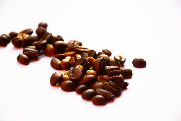 coffee beans in shape of heart isolated on white