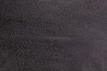 Black eco-leather close-up. Skin texture