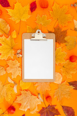 Autumn clipboard mockup with fall leaves