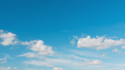 Blue sky background with cumulus clouds