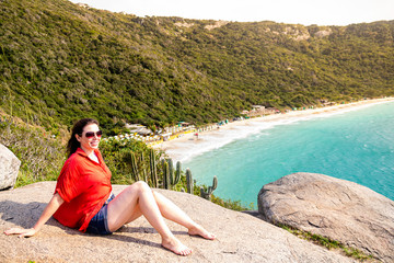 Beautiful model enjoying the sunrise with a beautiful landscape at the bottom of the sea.