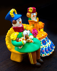 Dymkovo souvenir toy. On a dark background