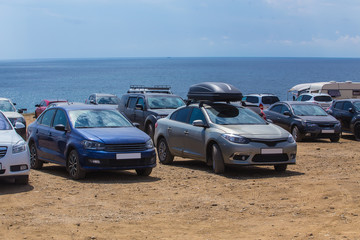 Fototapeta na wymiar Cars on a camping by the sea