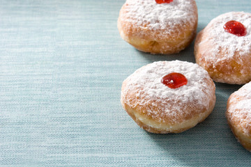 Hanukkah sufganiyot. Traditional Jewish donuts for Hanukkah. Copy space