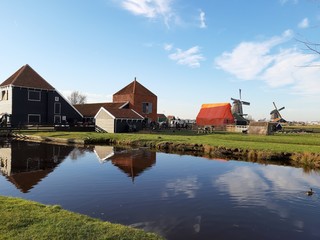 The Dutch Dutch suburb of Zaansche Schans. The water channels, the serene climate and the typical windmills.