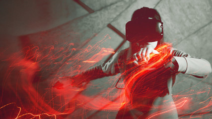 girl uses a virtual reality helmet, the concept of modern technology, the effect of double exposure.