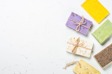 Natural soap bars on white top view.