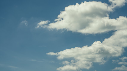 Fototapeta na wymiar Fluffy Cloud Blue Sky Background