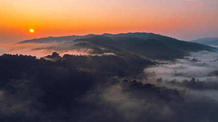 Sunrise in the morning mountains and fog