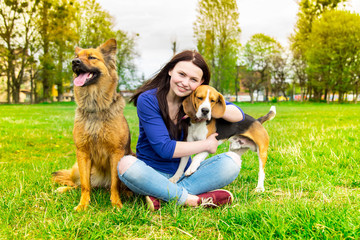 Girl with dogs in the park