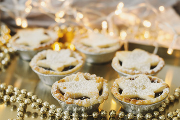 Mince pies served on a metal tray. Traditional Christmas dessert