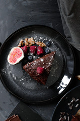 chocolate cake with fresh berries and nuts