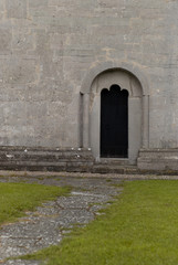 old church door in stone wall
